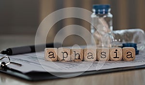 Word APHASIA composed of wooden dices photo