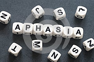 Word aphasia on toy cubes
