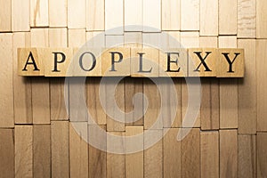 The word Apoplexy was created from wooden cubes. Health and life Close up. photo