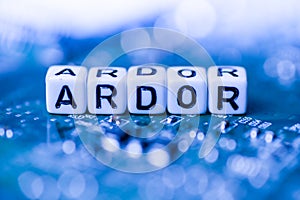 Word ARDOR formed by alphabet blocks on mother cryptocurrency photo