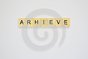 Word arhieve. Top view of wooden blocks with letters on white surface