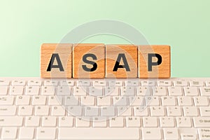 The word ASAP As soon as possible, Internet abbreviation used in communication, e.g. in business, The inscription on wooden blocks