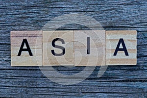 Word asia made from wooden gray letters