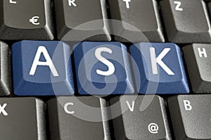 Word Ask spekked on computer keyboard