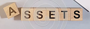 Word Assets on wooden cube blocks. Financial accounting. Money concept