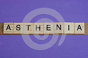 word asthenia in small square wooden letters