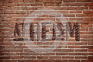 Word Atheism on brick wall. Philosophical or religious position