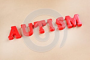 Word Autism made with red letters