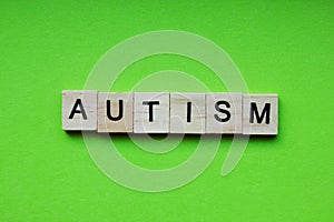The word Autism is made of wooden cubes with letters. The concept of autism spectrum disorder ASD, healthcare for hospitals,