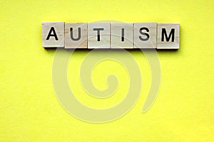 Word Autism is made of wooden cubes with letters. Concept of autism spectrum disorder ASD, healthcare for hospitals, clinics and