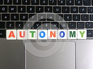 Word Autonomy on keyboard background