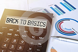 Word BACK TO BASICS on calculator. Business and finance concept