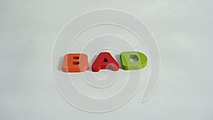 The Word BAD Spelled With Colorful Wooden Letters