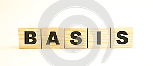 The word BASIS. Wooden cubes with letters isolated on white background.