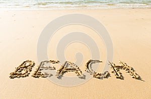 Word beach written on beach