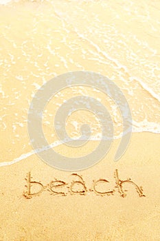 Word beach written in the sand of a beach