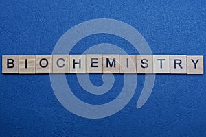 Word biochemistry from small gray wooden letters