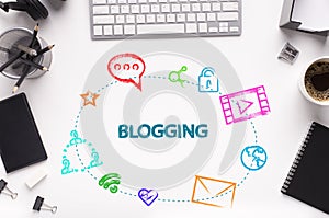 Word BLOGGING and web icons on office desk with gadgets and stationery, white background. Flat lay. Collage