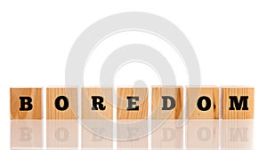 The word - Boredom- on wooden cubes