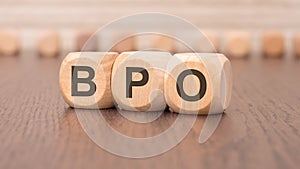 word bpo - Business Process Outsourcing - is written on wooden cubes