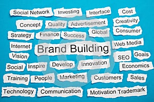 Word brand building on piece of torn paper