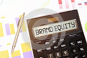 Word BRAND EQUITY plus on calculator. Business and tax concept