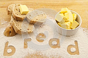 Word bread written in flour bread and butter