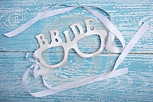 Word BRIDE with ribbons