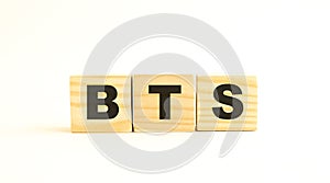 The word BTS. Wooden cubes with letters isolated on white background