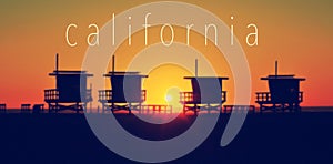 The word California and some lifeguard towers in Venice Beach at