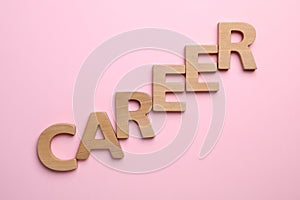 Word CAREER made with wooden letters on background, flat lay