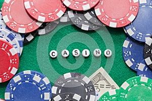 Word `casino` with poker chips and money