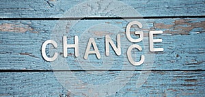 Word change to chance in letters on light blue wooden background. Personal development career growth or change yourself concept