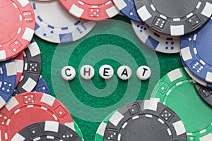 Word `cheat` with poker chips