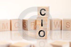 Word cio from wooden blocks with letters, concept