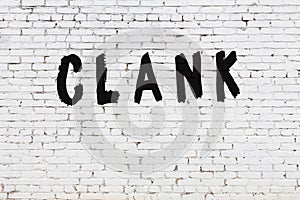 Word clank painted on white brick wall