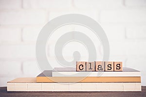 The word CLASS, letters and copy space background, vintage