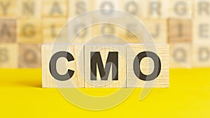 word cmo made with wood building blocks, concept