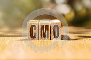 The word CMO on wooden cubes. Business concept