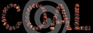 Word COAL made of red hot coal nuggets stones isolated on black, burning natural black charcoal piece letters, glowing embers