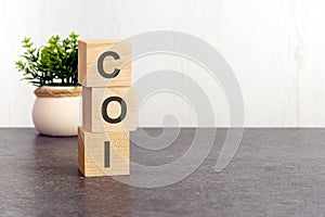 word coi made with wood building blocks