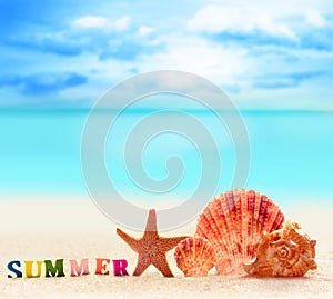 Word of color letters on summer beach and starfish