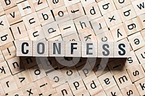 The word of CONFESS on building blocks concept photo