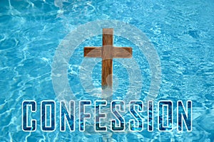 Word Confession near wooden Christian cross in water