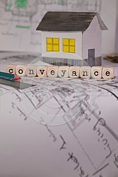 Word CONVEYANCE composed of wooden letters. photo