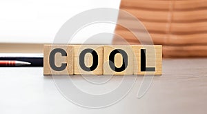 word cool made of wooden block isolated on white background