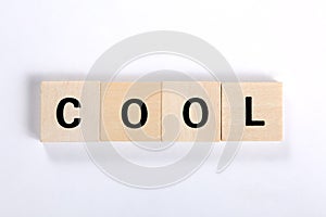 Word cool made of wooden blocks isolated on white background