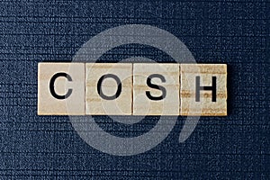 Word cosh from gray wooden letters