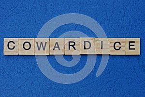 Word cowardice made from brown wooden letters