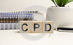 The word CPD arranged from wooden letters